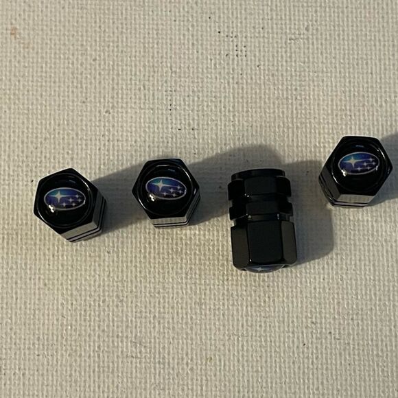 Subaru logo valve Stem caps in black set of 4 NWT - Picture 1 of 4
